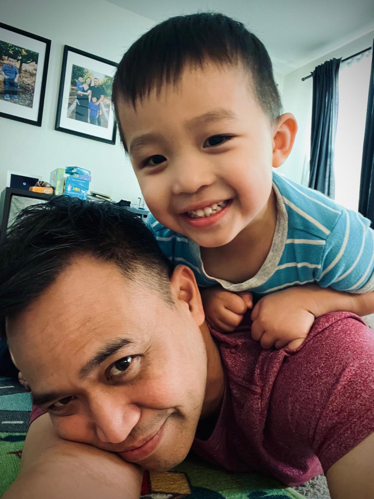 George with one of his sons at home